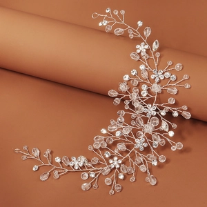 Detailed macro view of handmade silver bridal headband with crystals and vine pattern
