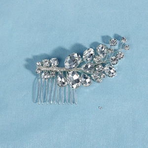 Detailed view of handmade silver bridal hair comb with intricate crystal rhinestone wiring