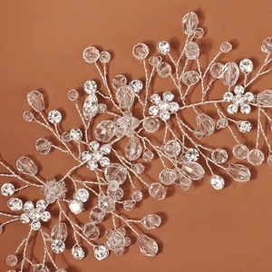 Luxurious silver crystal bridal headband with delicate leaves and shiny rhinestones