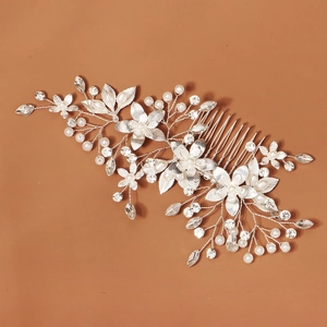 Silver bridal hair comb with elegant white pearls and crystals in floral leaf design
