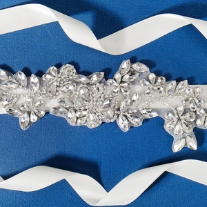 Exquisite crystal bridal sash with floral rhinestones on a white satin ribbon for wedding gowns