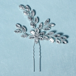 Detailed macro view of bridal hair pin featuring silver marquise crystals and twisted wire