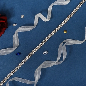 Elegant gold bridal belt with double-row marquise rhinestones on a dark blue background