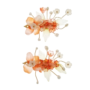Handmade Chinese bridal hair clips with resin flowers, pearls, and gold wire accents