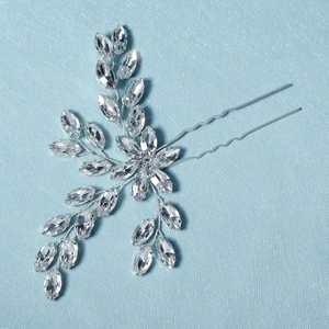 Detail of silver bridal hair pin with marquise rhinestones and floral leaf pattern