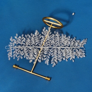 Detailed macro view of handmade bridal crystal headband with silver wire and beads
