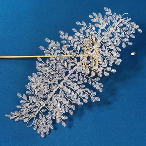 Elegant silver leaf crystal headband with shimmering beads for bridal or stage hairstyle