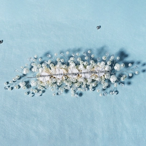 Detail of handcrafted bridal headband showing white pearls and crystal bead weaving