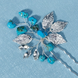 Detail of silver leaf and turquoise beads on handmade bridal hair pin with crystal accents