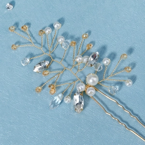 Detail of handmade bridal hair pin with pearls, crystals and golden wire branches