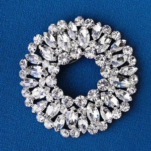 Detail of a sparkling circular rhinestone shoe clip with marquise-cut crystals for bridal shoes