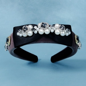 Detail of grey velvet sponge headband with satin bow, white pearls and grey rhinestones