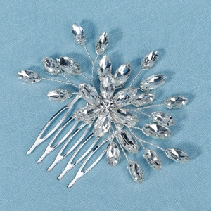 Detailed macro view of handmade crystal bridal side comb with marquise cut rhinestones