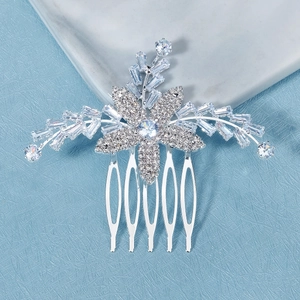 Detailed macro view of silver flower bridal hair comb with shimmering zircon inlay