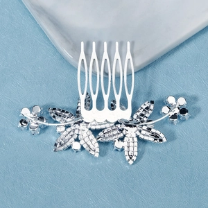 Detailed macro view of silver flower bridal hair comb with cubic zirconia rhinestones