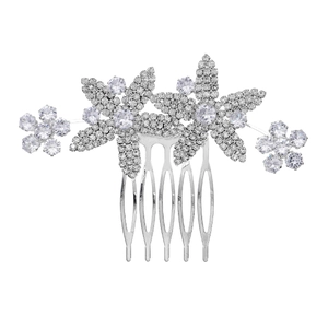 Macro view of silver bridal hair comb with floral rhinestone design and five-tooth clip