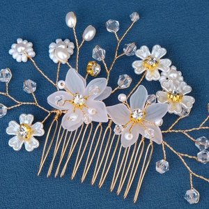 Handmade bridal hair comb with gold wires, white pearls, flowers, and sparkling crystals