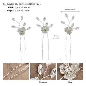 Detail view of handmade silver hair pins with rhinestones and alloy flowers for bridal styling