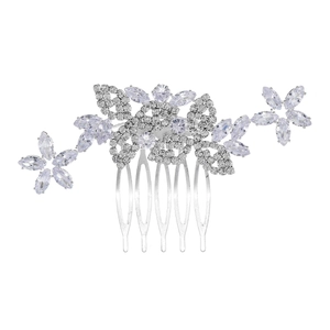 Macro detail of bridal hair comb with cubic zirconia flowers and silver leaves