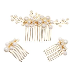 Macro detail of handmade pearl hair combs for wedding hairstyles with golden wire weave