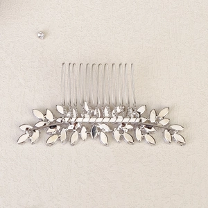 Detail of silver leaf hair comb with sparkling marquise rhinestones and metal teeth