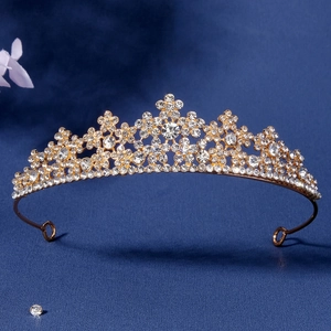 Elegant gold hollow crown with sparkling rhinestones and floral design for bridal parties