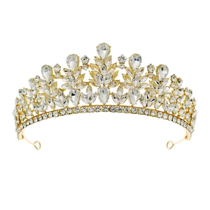 Detailed view of bridal crown with gold metal leaf design and sparkling crystals