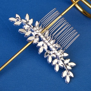 Elegant silver bridal hair comb with crystal leaf patterns for wedding hair styling