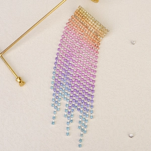 Detailed macro view of colorful rhinestone tassel hair clips with gradient crystals