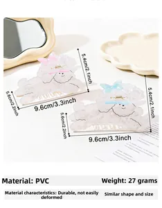 Détail montrant les dimensions des pinces à cheveux chien teddy avec nœuds rose et bleu