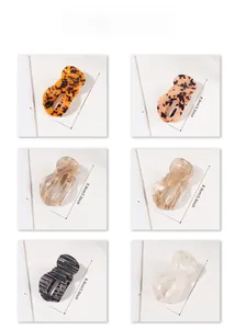 Detailed views of diverse patterned hair claws with precise dimensions 8.9cm by 4.6cm