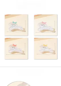 Détails d'une pince à cheveux petit chien de 9,6 cm avec nœuds colorés et tailles