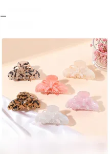 Detailed collection of elegant bow-shaped hair claw clips in various acetate patterns