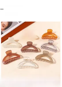 Detailed view of eight semi-circular resin hair claws in assorted translucent colors