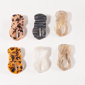 Set of six elegant 8-shaped claw clips in tortoiseshell and marble patterns for hair styling