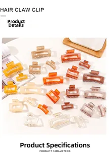 Macro view of transparent acrylic hair claw clips in various sizes and earth tones
