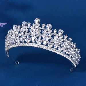 Close-up of silver bridal tiara with marquise and pear-cut crystal leaf patterns