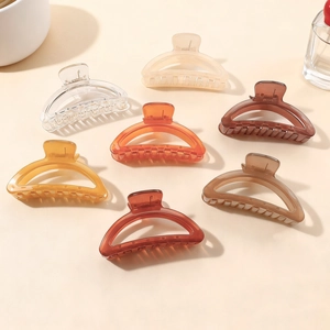 Transparent minimalist hollow semi-circle hair claws in assorted neutral colors for women