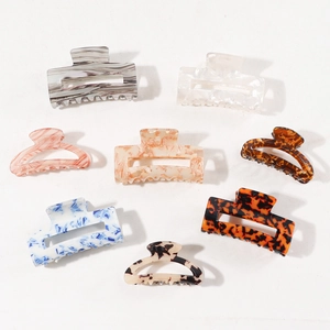Set of 8 rectangular acrylic hair claws in assorted marble and tortoiseshell patterns