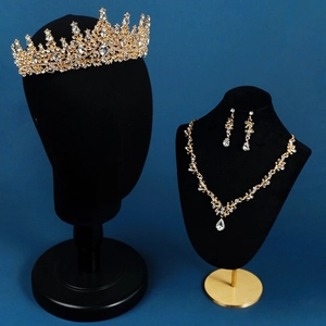 Elegant gold bridal jewelry set with sparkling crystals, crown, necklace and earrings