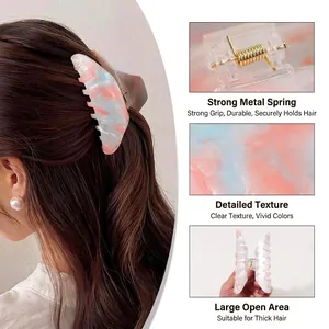 Large marbled hair claw clip in pink, blue, and white with strong gold metal spring