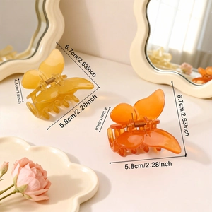 Transparent butterfly hair claw clips in amber and orange with size dimensions