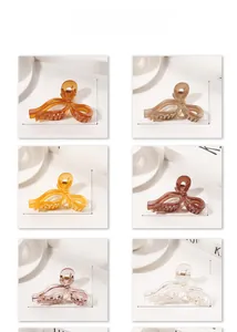 Detail showing 10.9cm bow hair claw clips in various colors with size dimensions