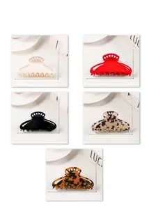Detailed view of 10.2cm large matte hair claw clips in various colors and dimensions