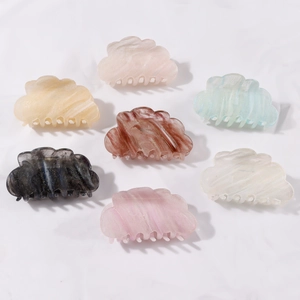 Set of seven dreamlike gradient cloud hair claws with glitter marble texture on white background