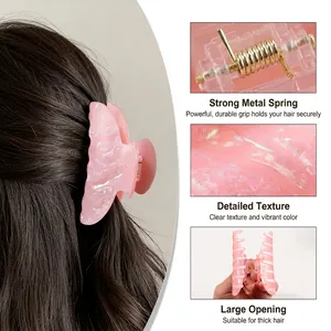 Pink pearlescent marble claw clip for thick hair with strong metal spring and model view