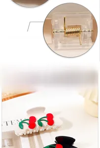 Detail view of the strong golden metal spring on a cherry blossom hair claw clip