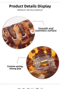 Detail view of the smooth tortoiseshell hair claw with a high-tension custom metal spring