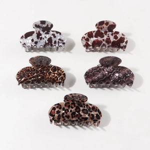 Five-piece leopard and animal print hair claws set on a clean white background