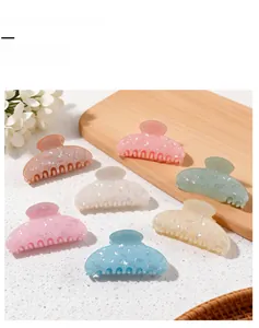 Morandi jelly shark hair clips set with sparkling finish on a wooden tray